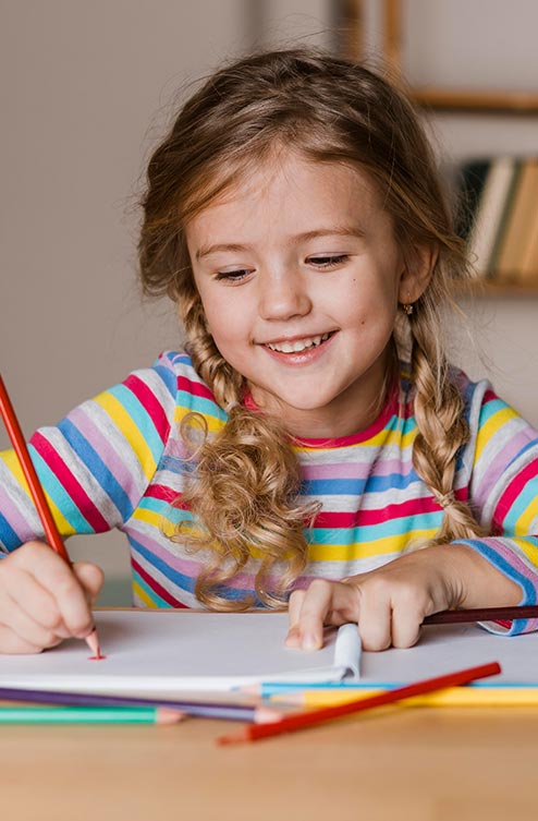 Student Engaged in Creative Classroom Activity