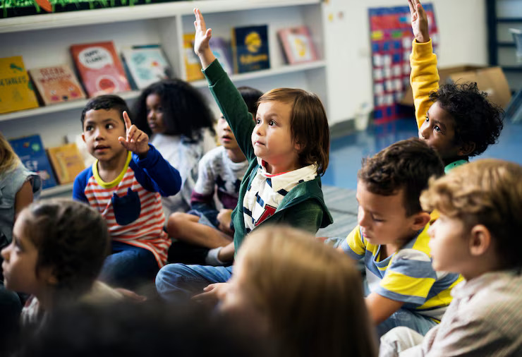 Happy Students Raising Hands During Classroom Session